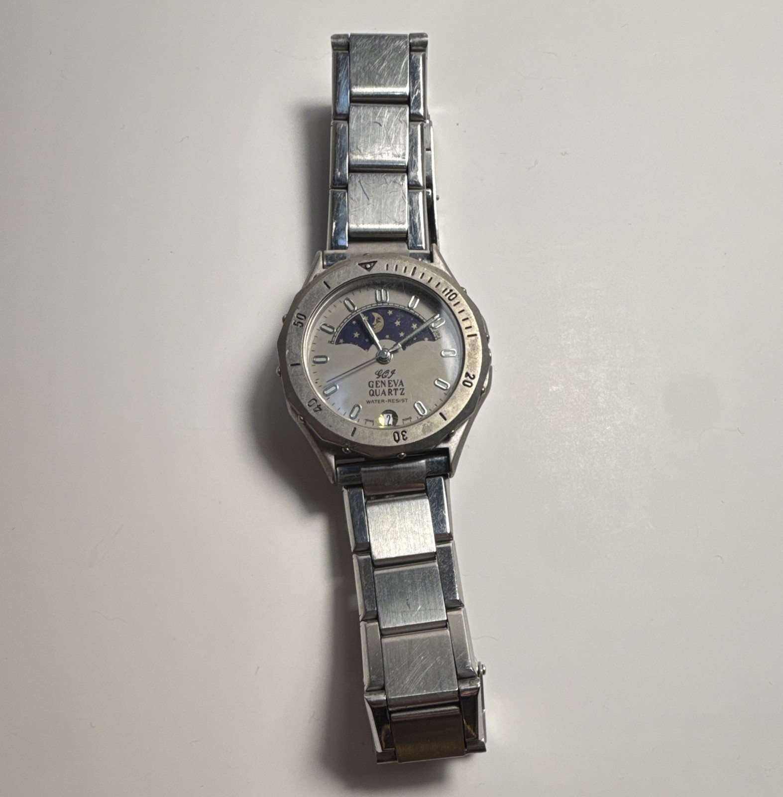 Geneva Quartz Moon Phase Date Water-Resistant Silver Tone Analog Metal Bracelet