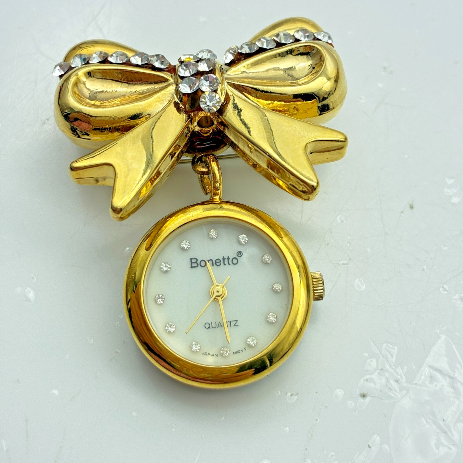 Bonetto Bow Brooch Watch Gold Tone Rhinestone Dangle Quartz Pin