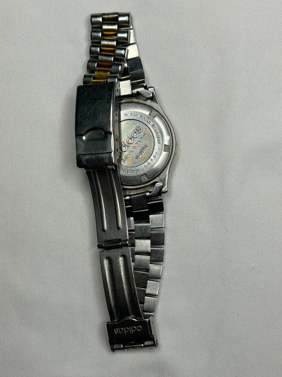 ​”Vintage Adidas Adventure watch with scratches. Not working, for repair/parts.”