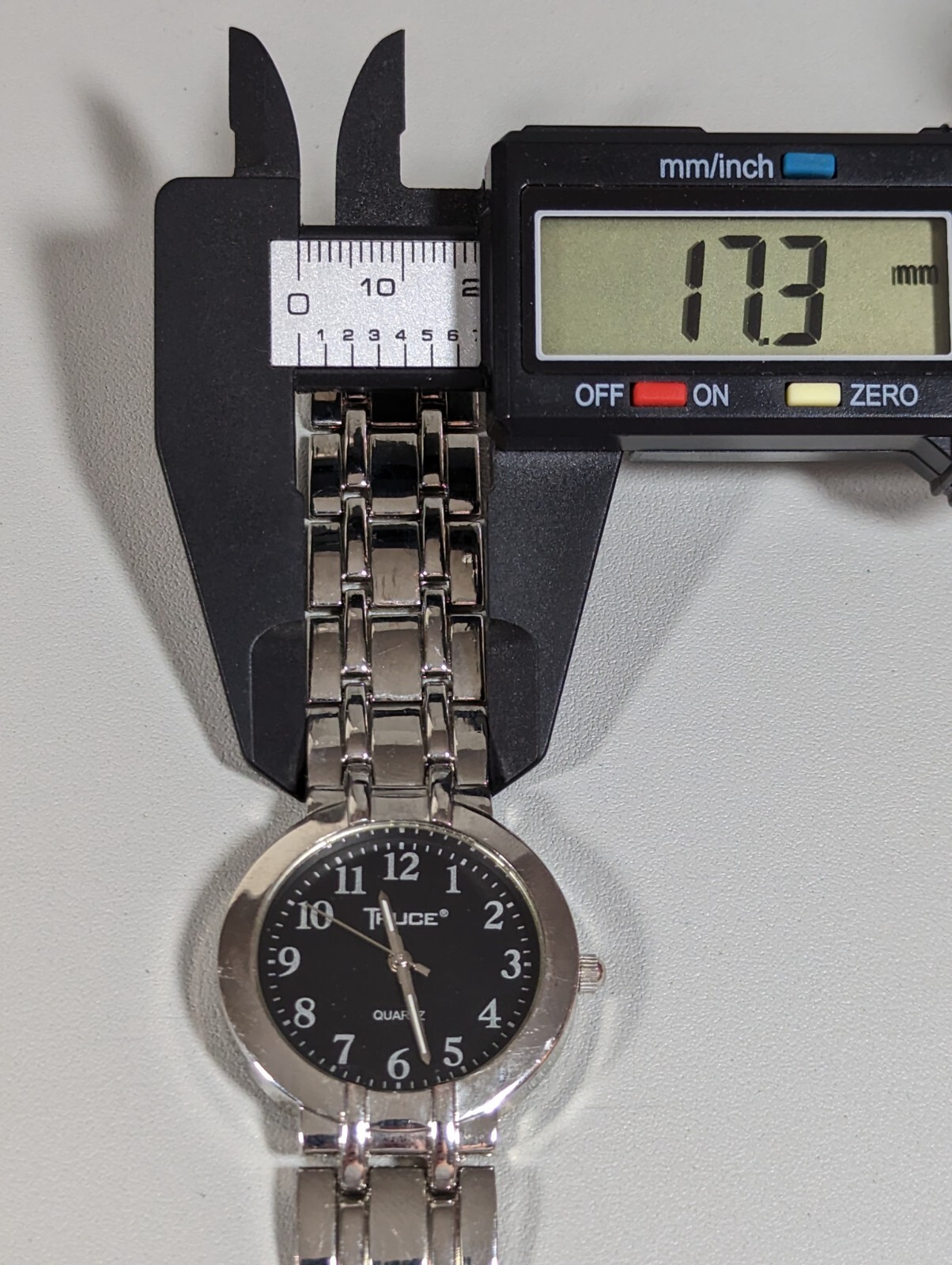 Truce Black Dial Round Silver Tone Case Link Band Watch