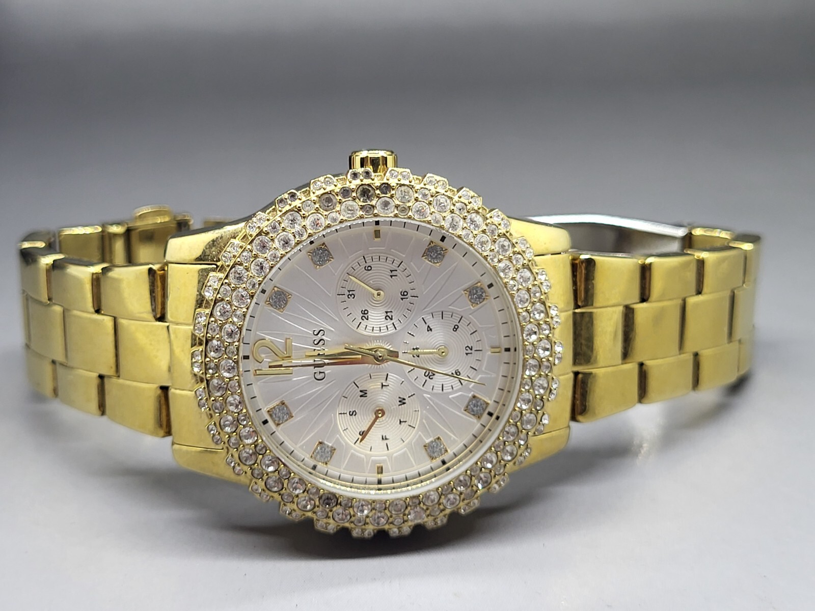 Guess Women’s Wrist Watch Gold Tone Metal with Stones Silver Dial Model U0335L2