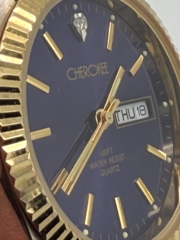 Cherokee Quartz Watch Day Date Blue Dial Two Tone Stretch Band Runs