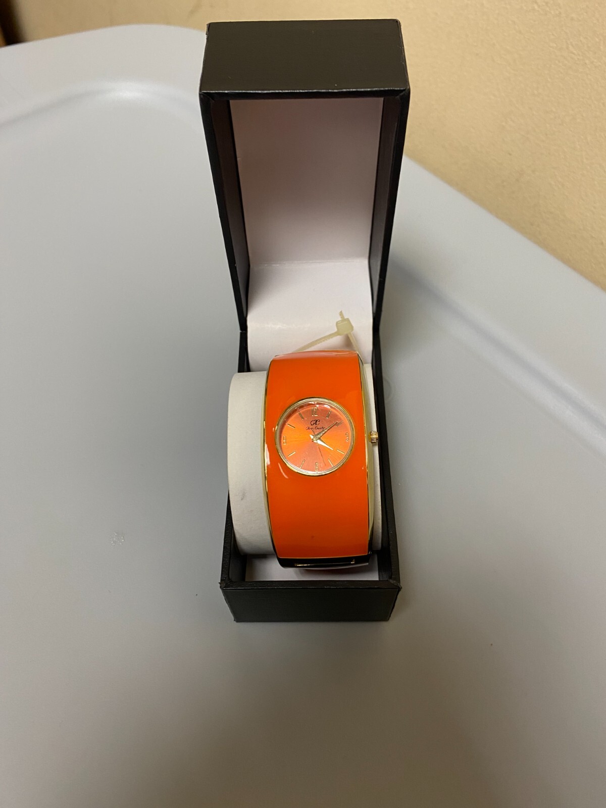 Women NWOT “Glen Candy” orange snap on metal orange watch.
