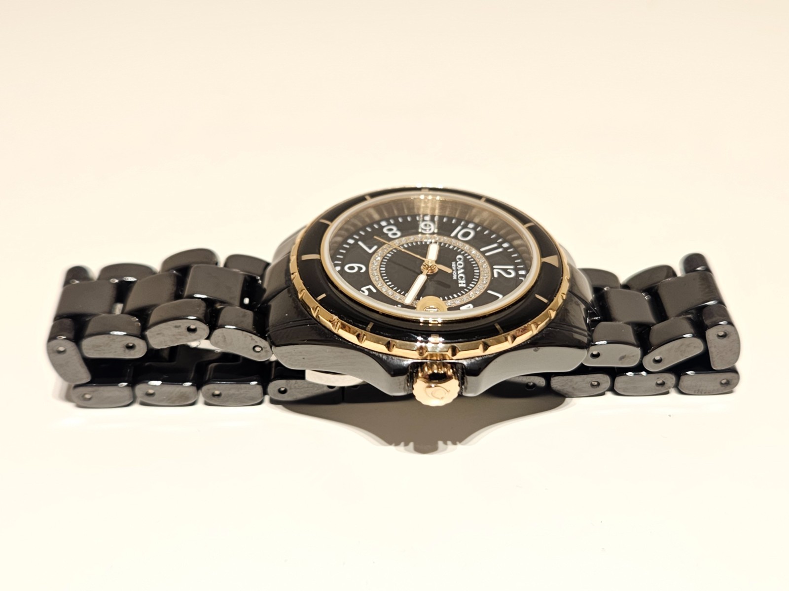 LESS USED LUXURY BLACK CERAMIC LADIES 33mm QUARTZ WATCH “COACH” NEW YORK PRESTON