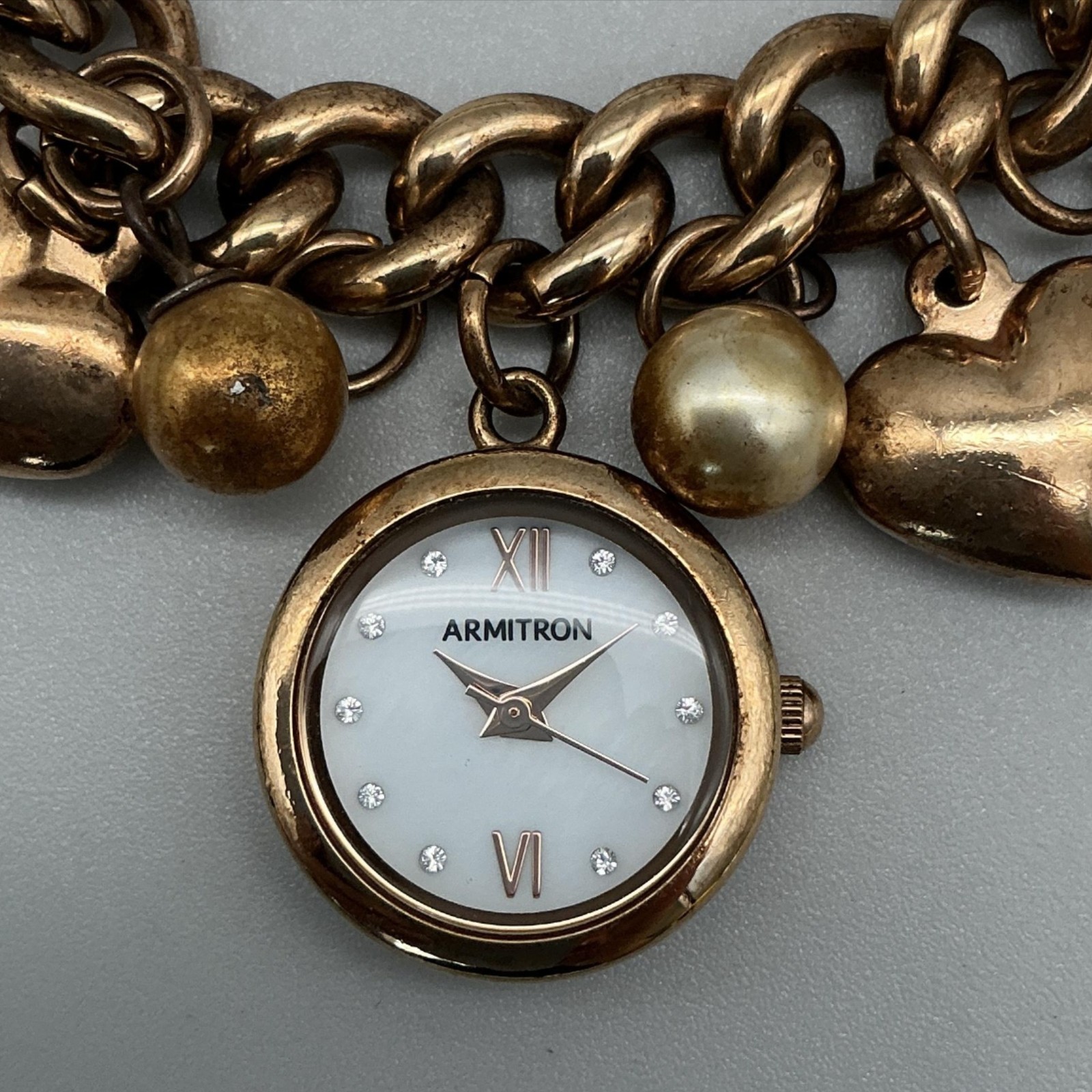 Armitron Womens Watch 20mm Charm Bracelet Hearts Gold Tone MOP New Battery 7.75″