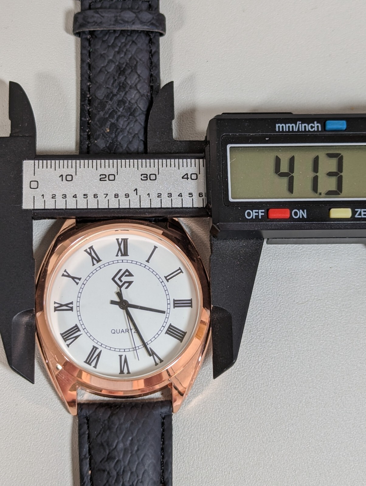 White Dial Gold Tone Round Case Black Faux Leather Band Watch