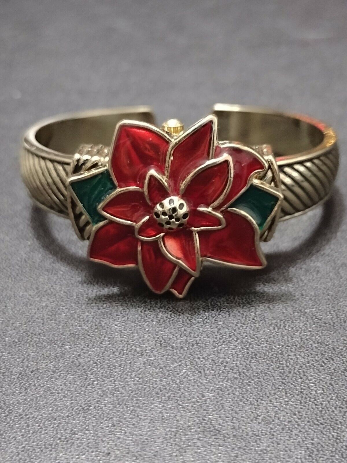 Gold tone poinsettia watch bracelet