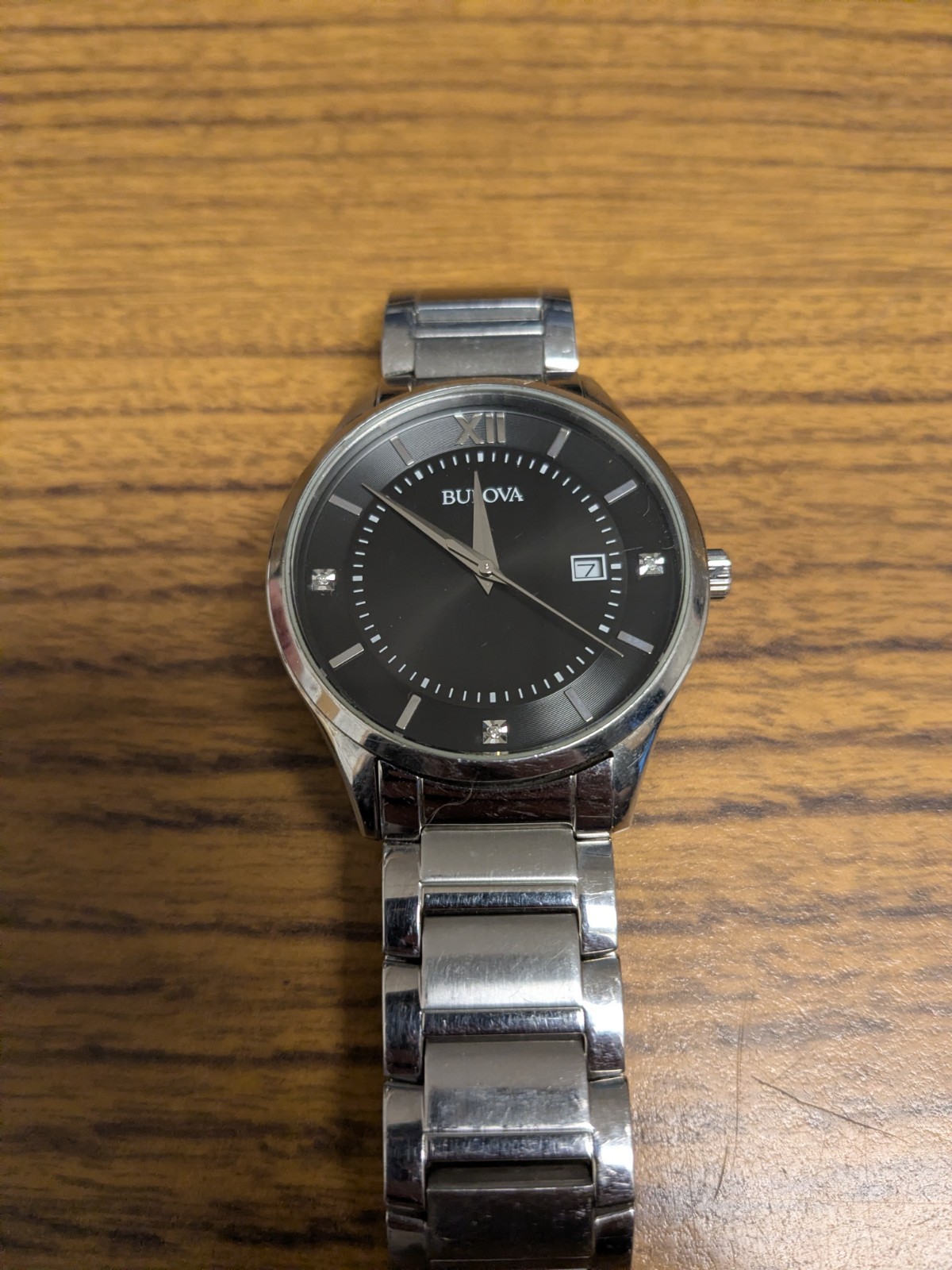 Bulova Classic 96D142 watch features a black dial accented with diamond markers
