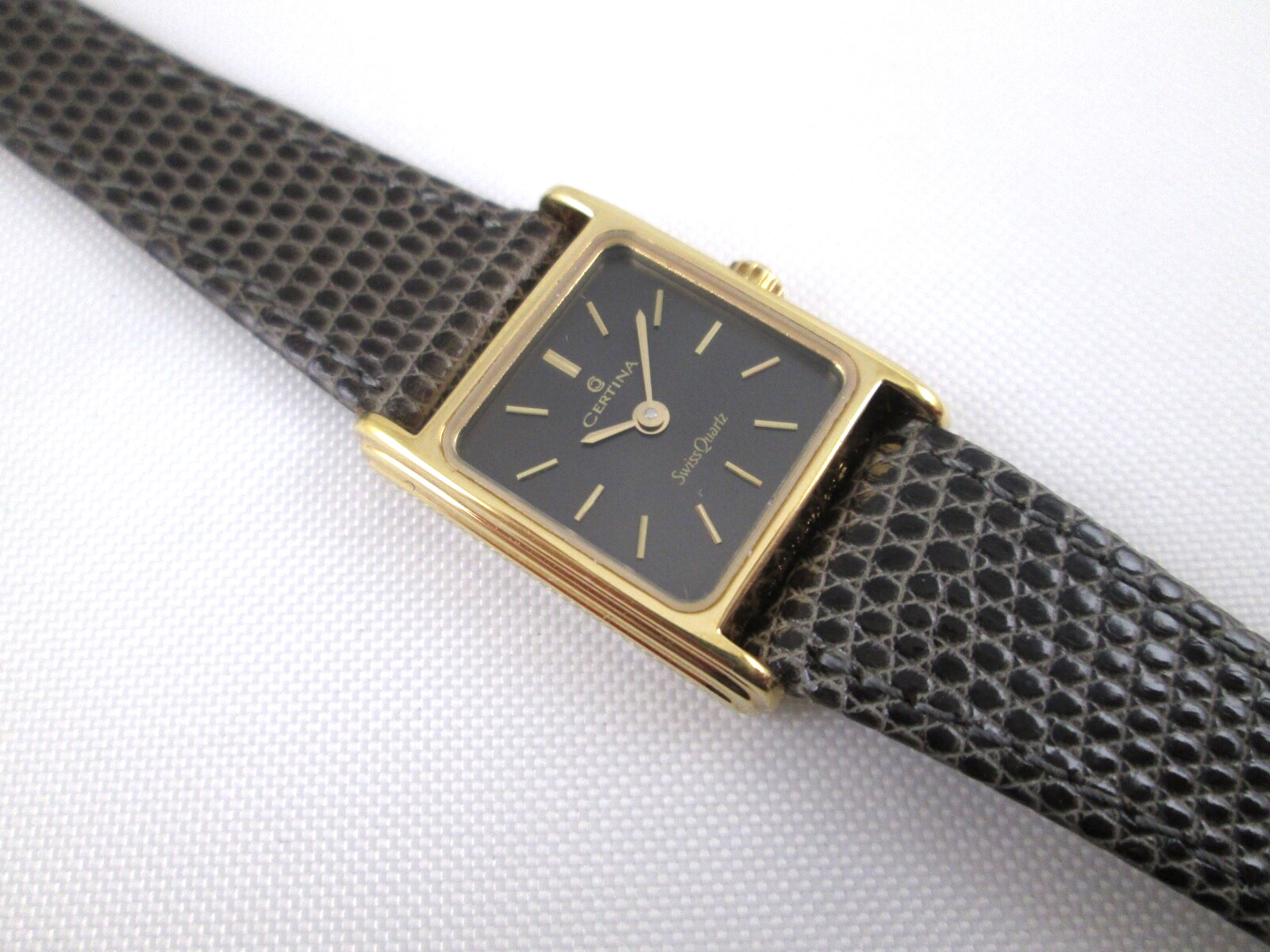 Certina lady’s quartz watch gold tone black dial 18.5mm wide Swiss Made AS IS