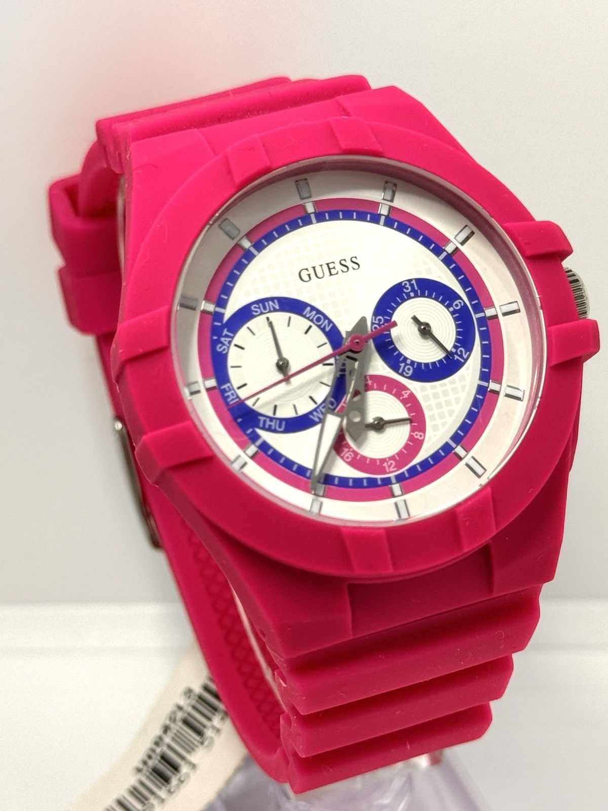 GUESS Ladies Pink Rubber Band Watch with a White Analog Dial and Multicolor