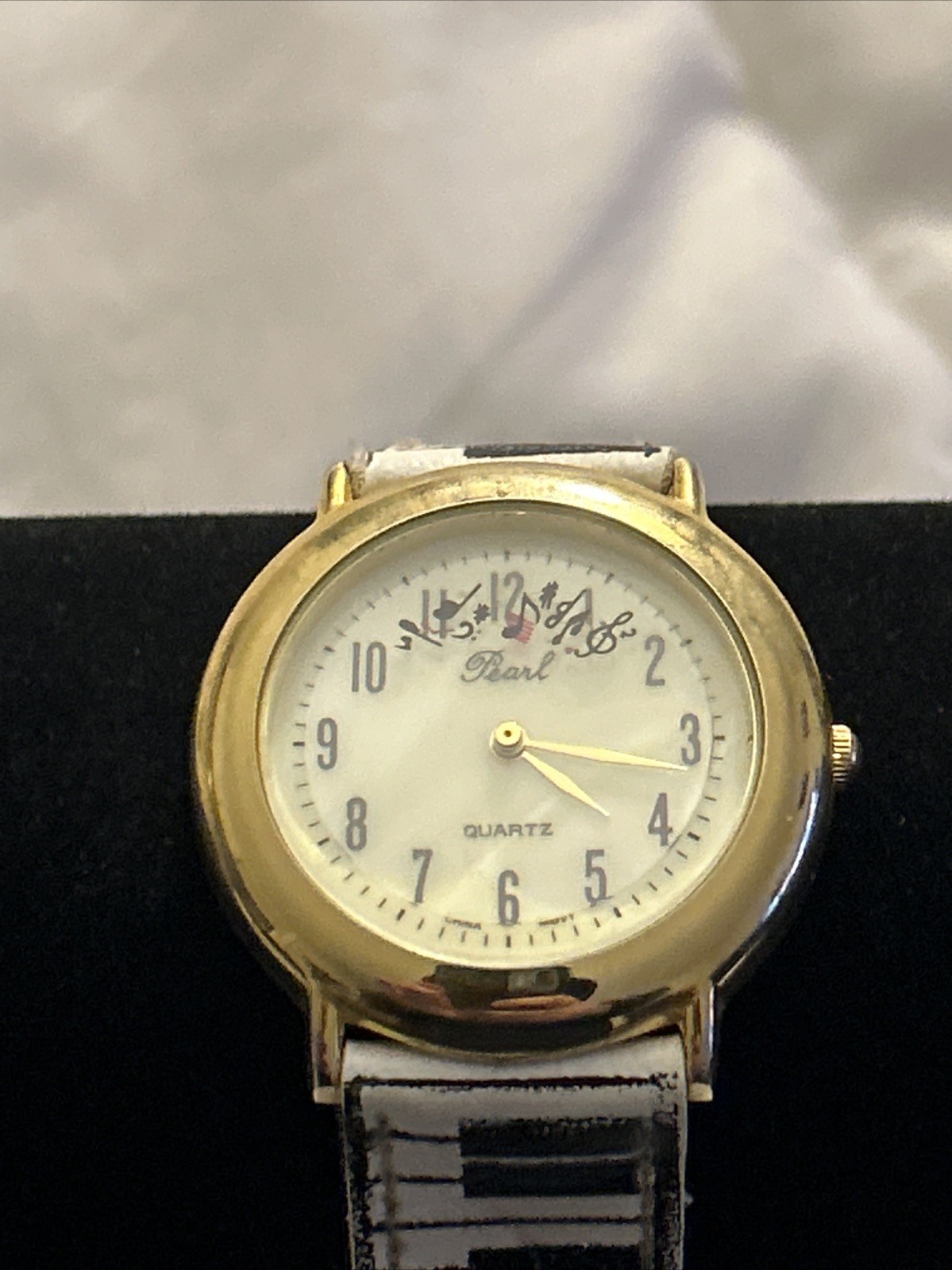 Vintage Pearl Music Watch 35mm Gold Tone Ticking Notes Piano Strap
