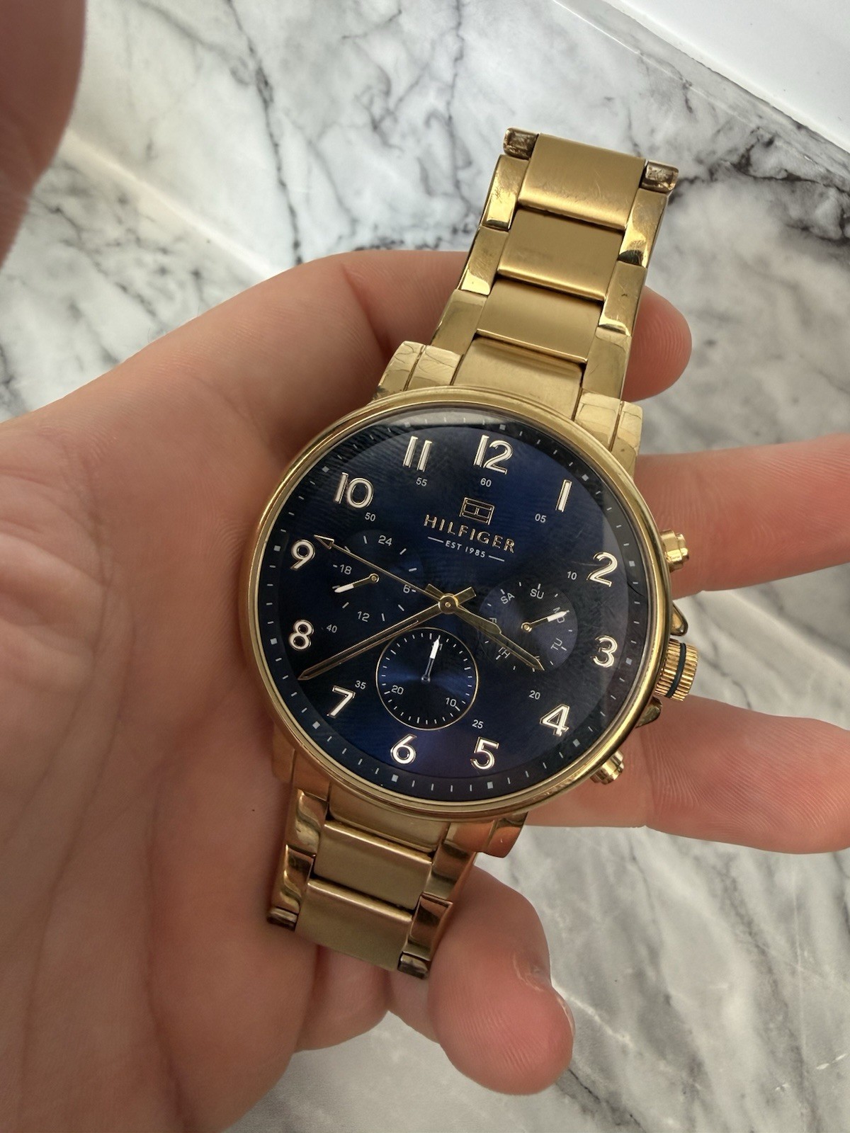 Tommy Hilfiger Men’s Watch 1710384 Daniel Blue Dial Gold tone Day Date Watch