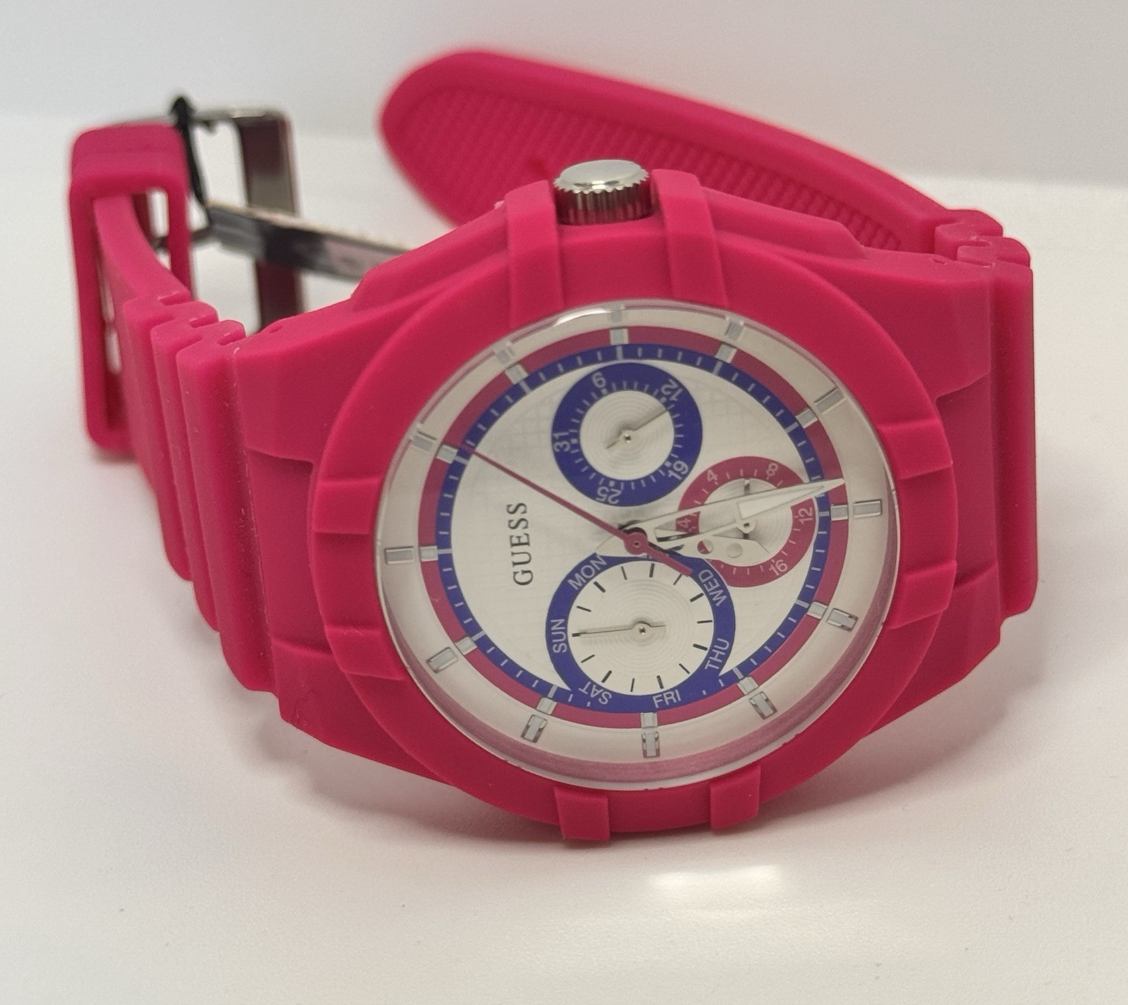 GUESS Ladies Pink Rubber Band Watch with a White Analog Dial and Multicolor