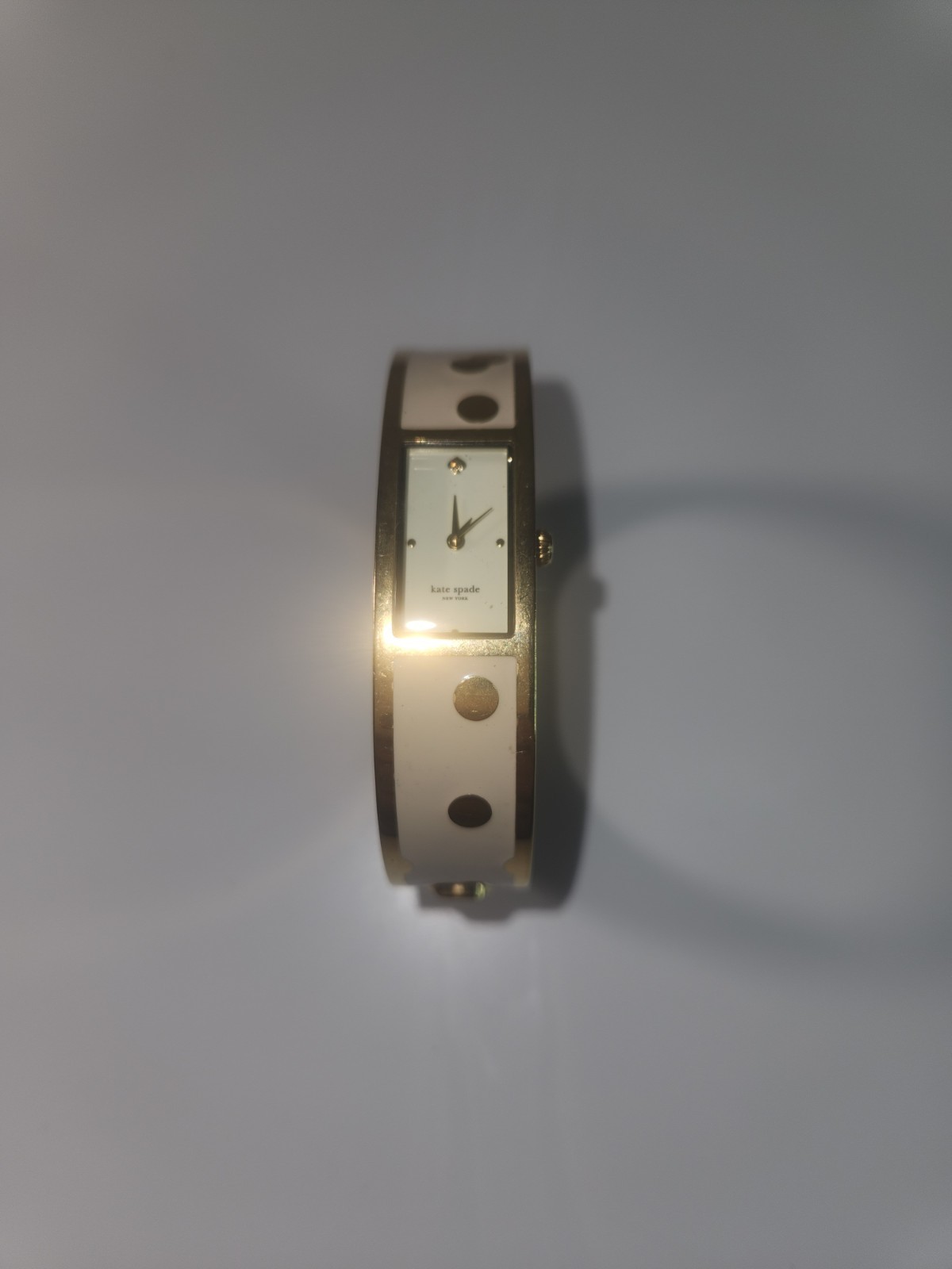 kate spade new york Women’s Quartz Gold/Ivory Bangle Watch, White Dial