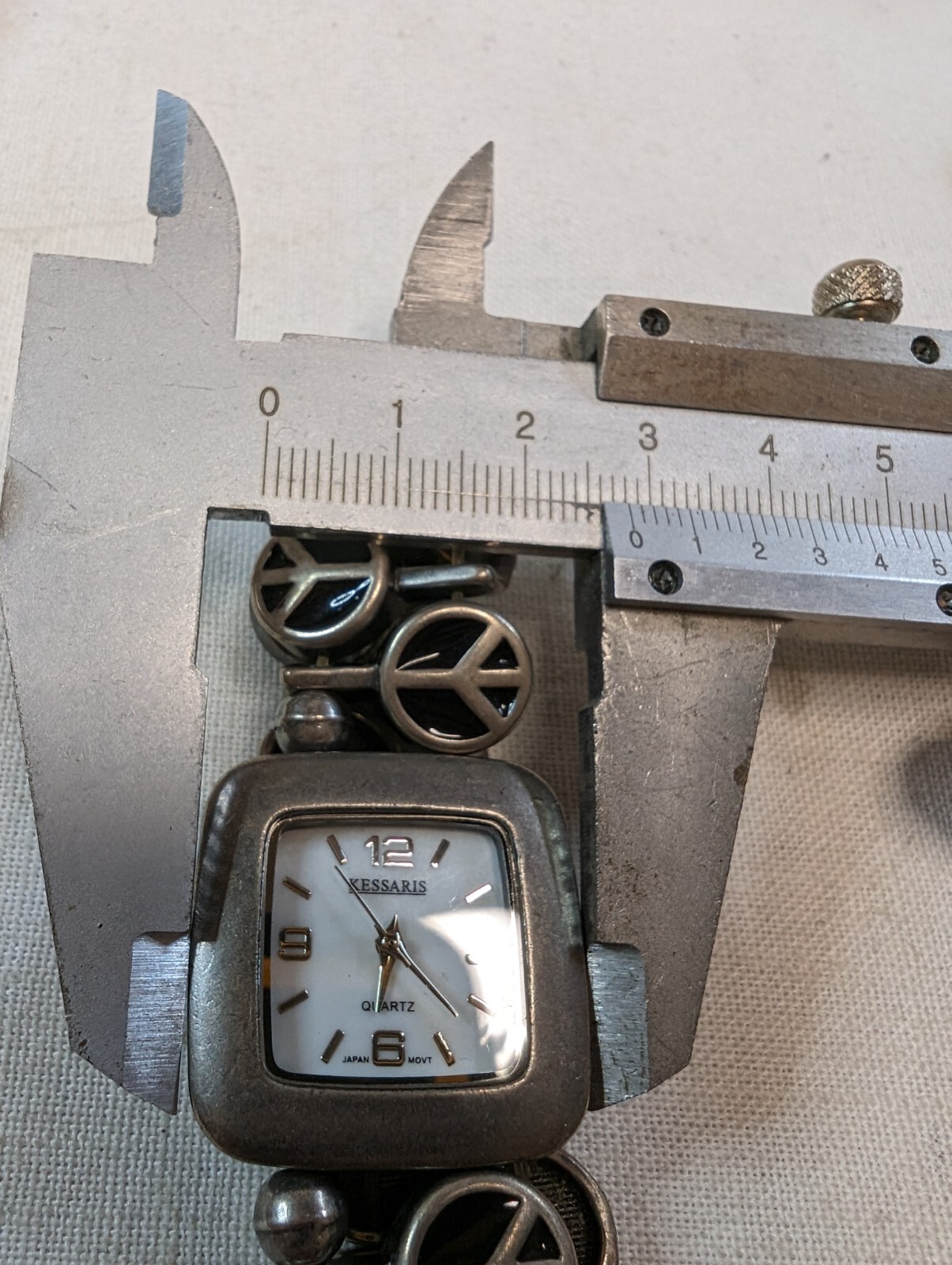 Kessaris Ladies Quartz Watch Rectangle Silver Tone On Peace Sign Bracelet
