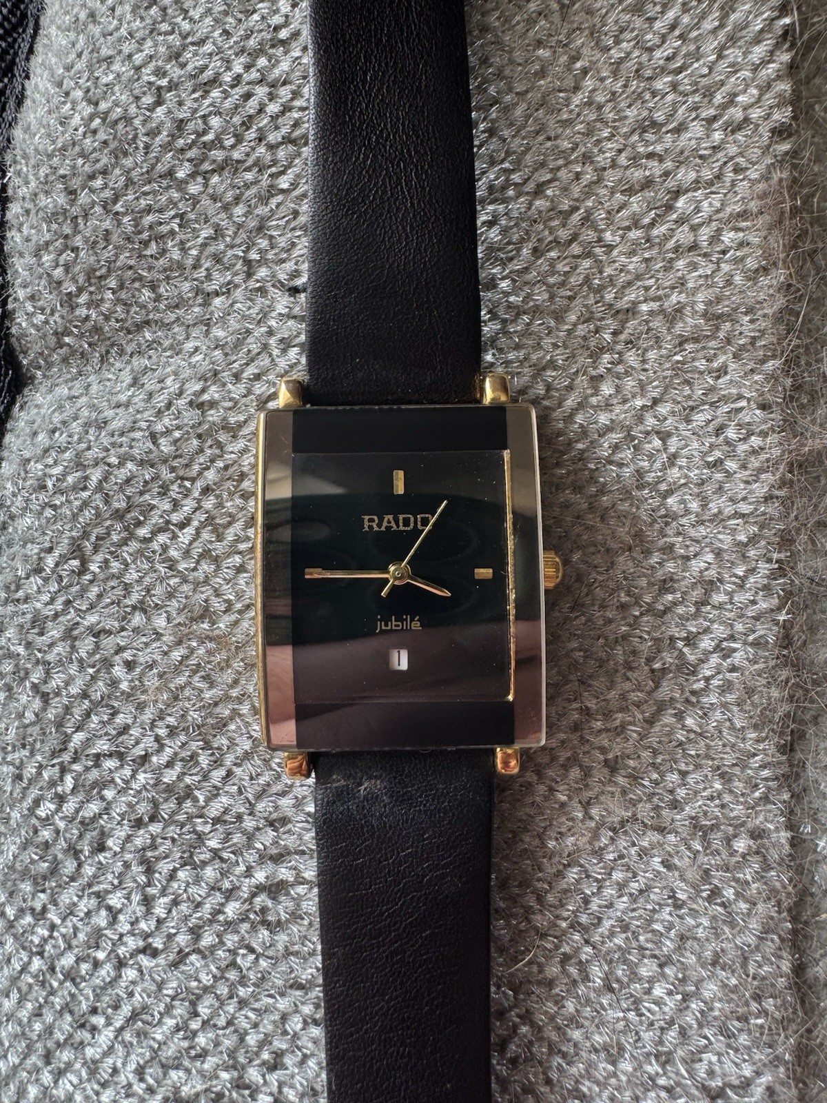 Rado Jubilé Quartz Rectangle Black Dial Date Gold Tone Case Black Leather Strap