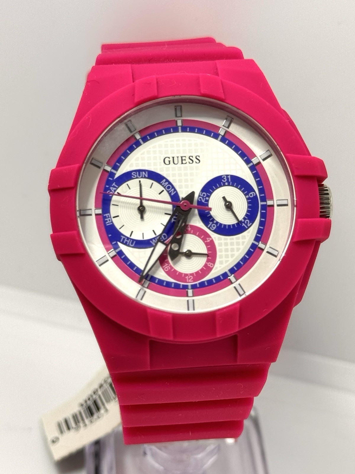 GUESS Ladies Pink Rubber Band Watch with a White Analog Dial and Multicolor