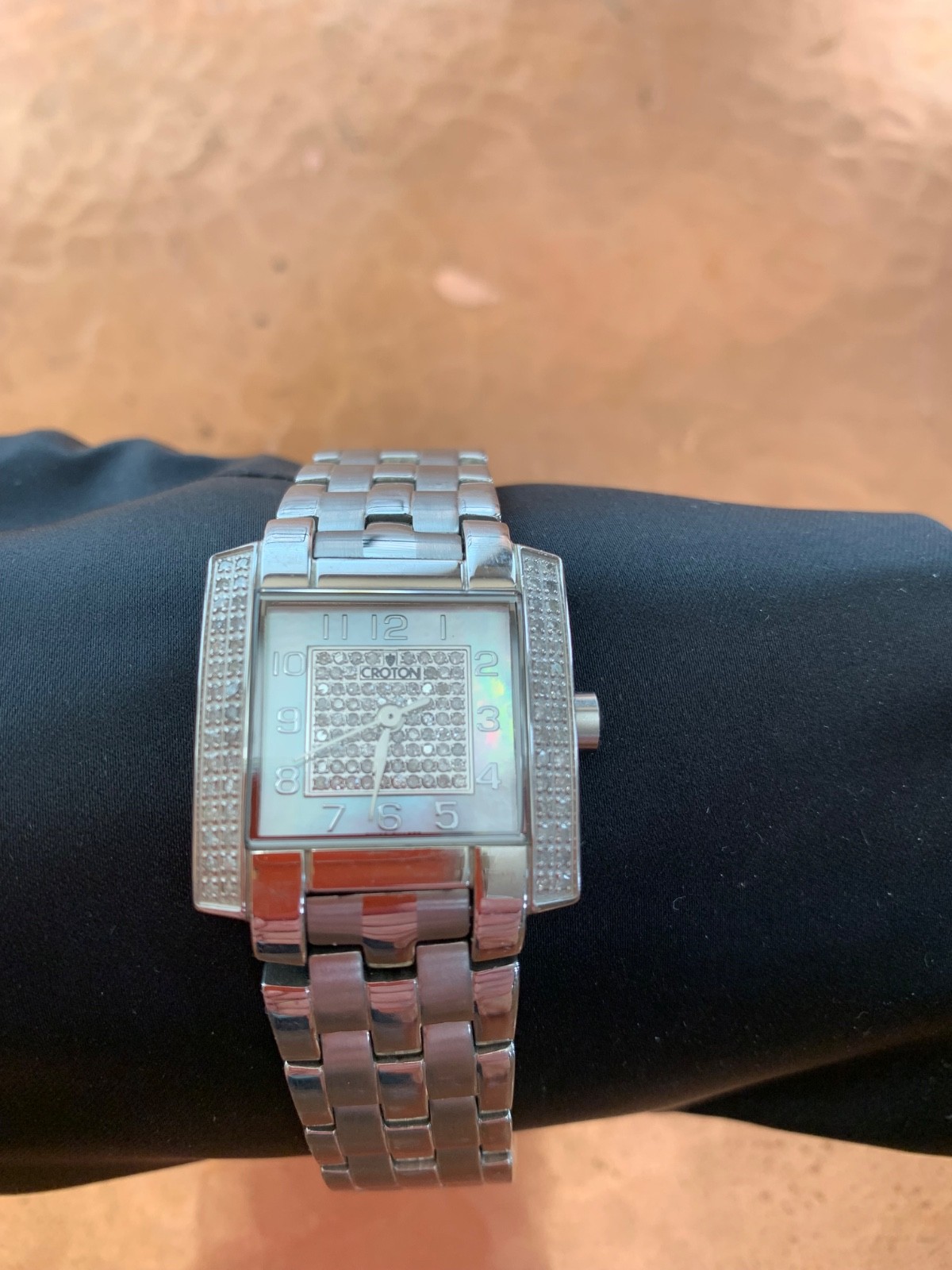 Croton stainless steel watch with mother of pearl face women