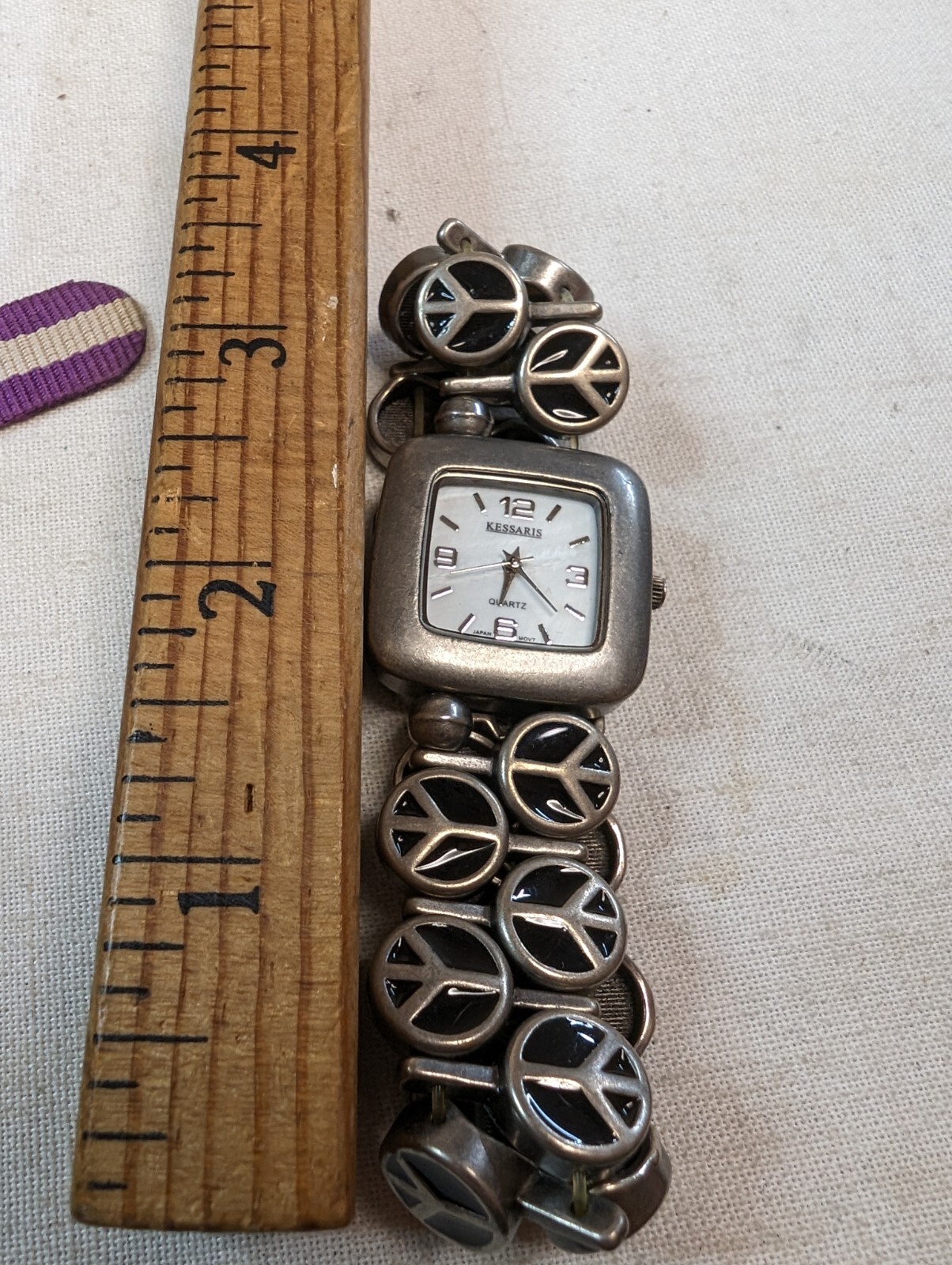 Kessaris Ladies Quartz Watch Rectangle Silver Tone On Peace Sign Bracelet