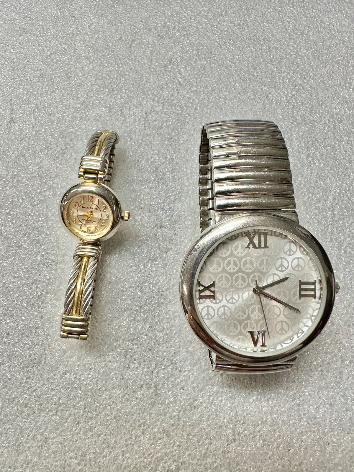 2 Working Quartz Watches Women’s Jaclyn Smith & Men’s Peace Face