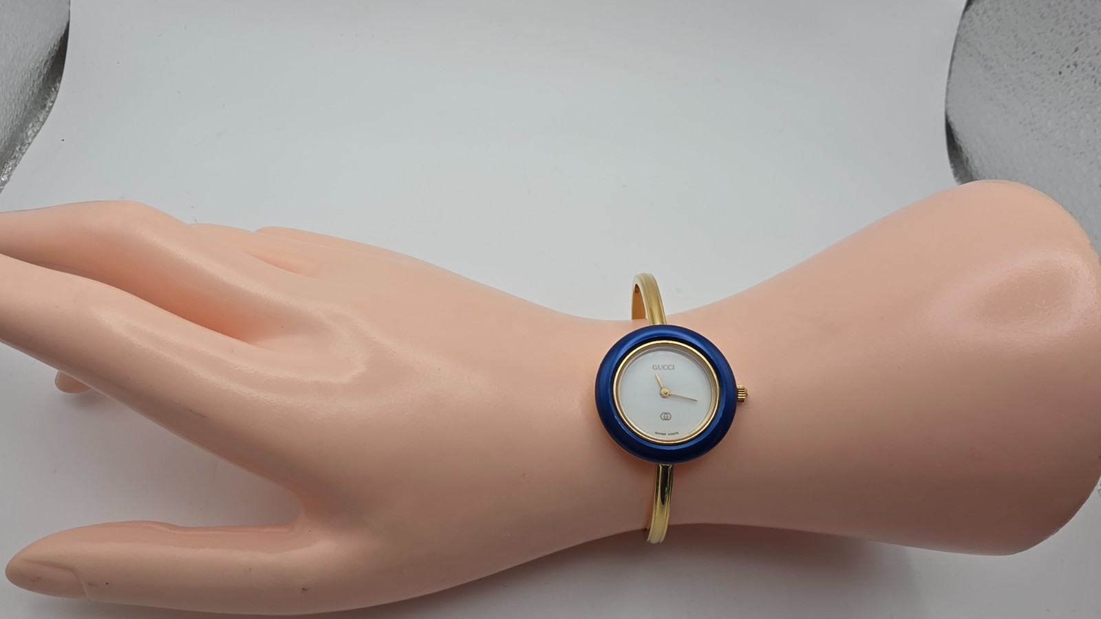 Gucci 1100-L, Lady’s Gold Plated Watch with Six Interchangeable Bezels in Box.