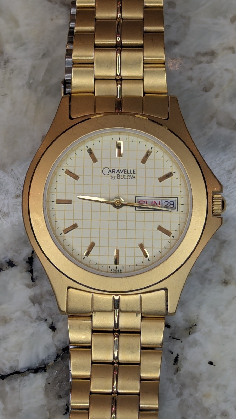 Vintage Caravelle by Bulova Men’s 35mm Quartz Day Date Gold Tone Grid Dial