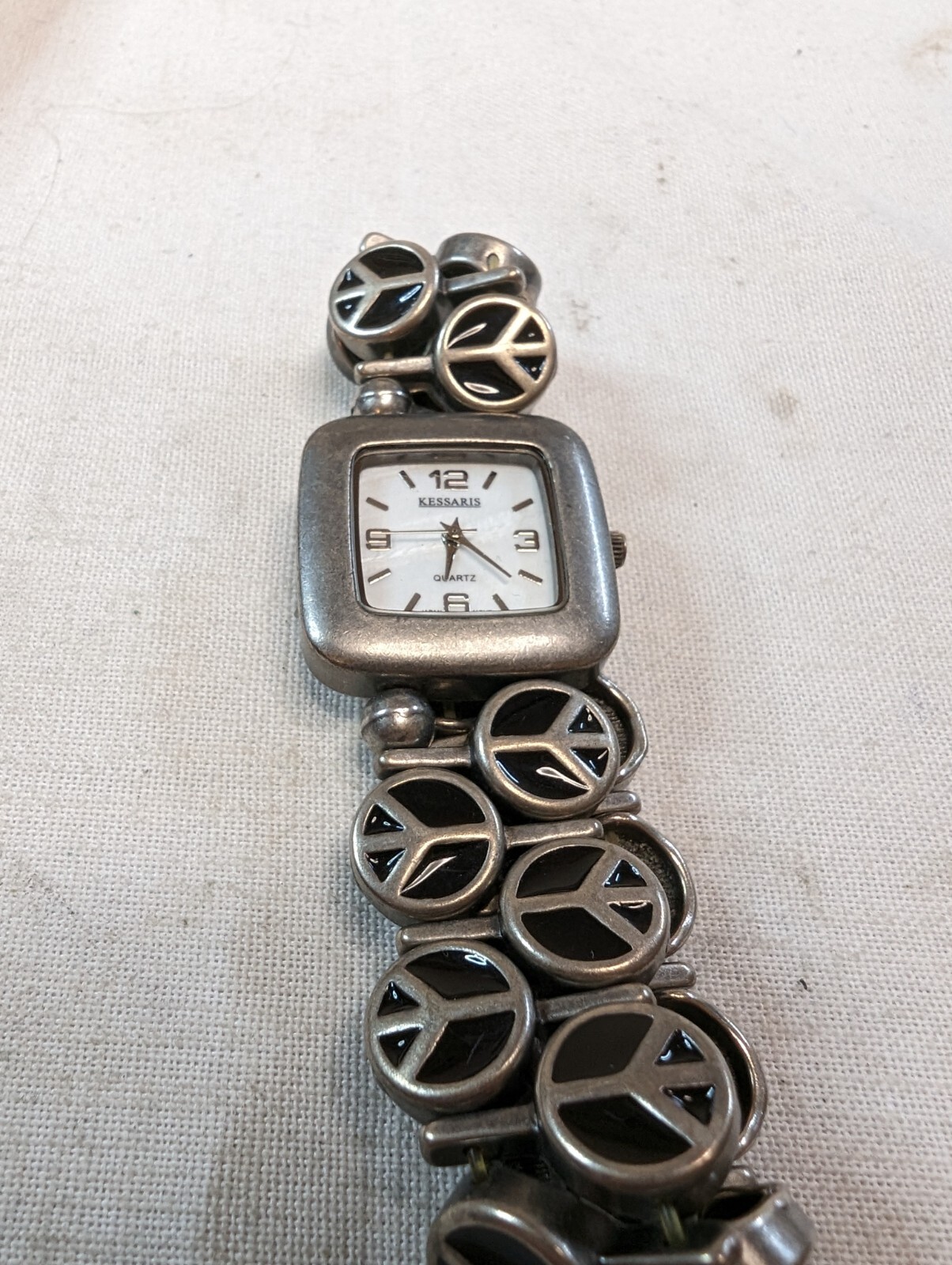 Kessaris Ladies Quartz Watch Rectangle Silver Tone On Peace Sign Bracelet