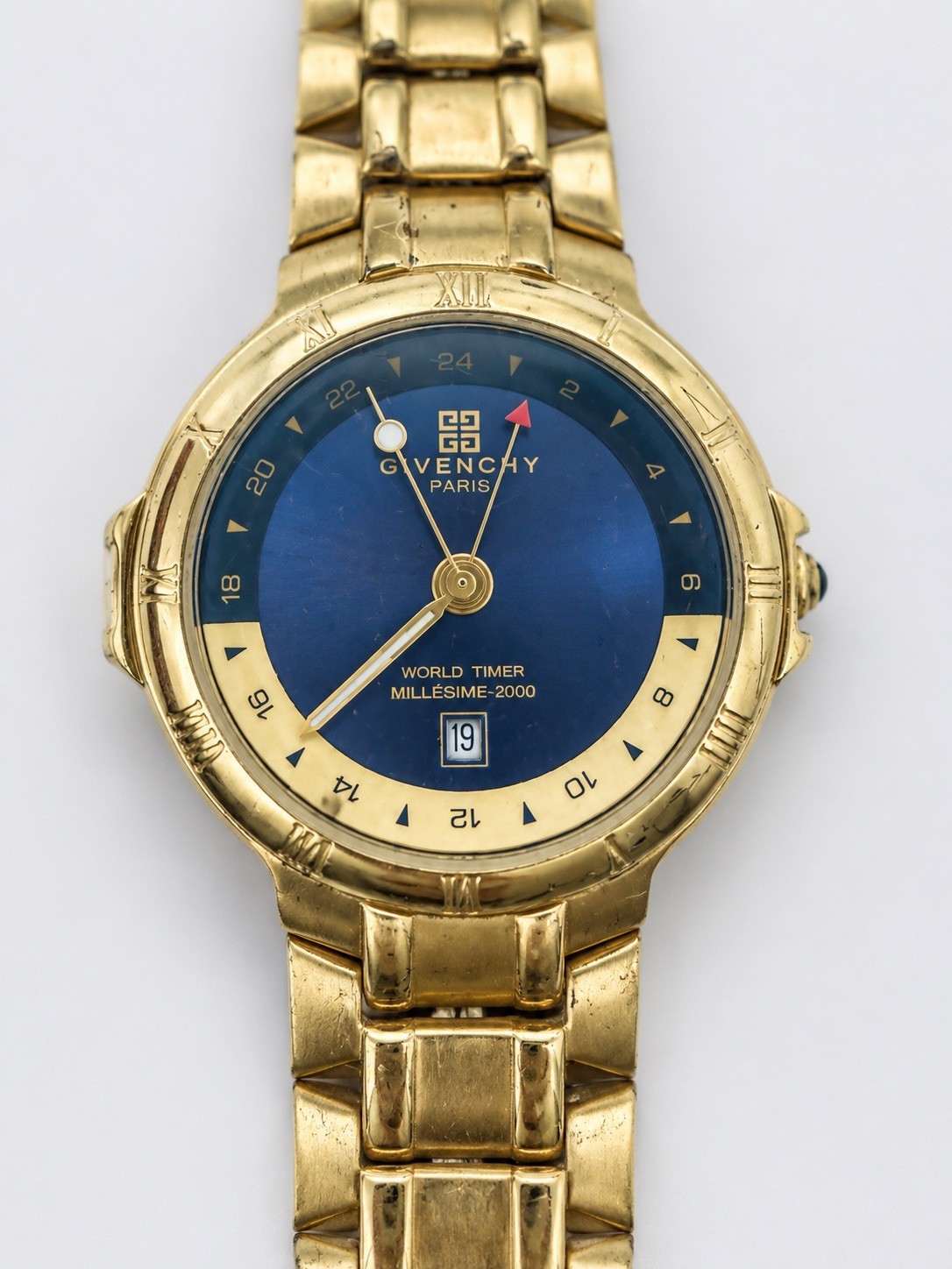 Givenchy Millesime 2000 World Timer Swiss Quartz Blue Dial Gold Tone Watch