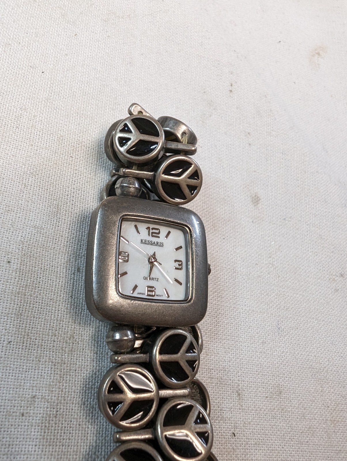 Kessaris Ladies Quartz Watch Rectangle Silver Tone On Peace Sign Bracelet