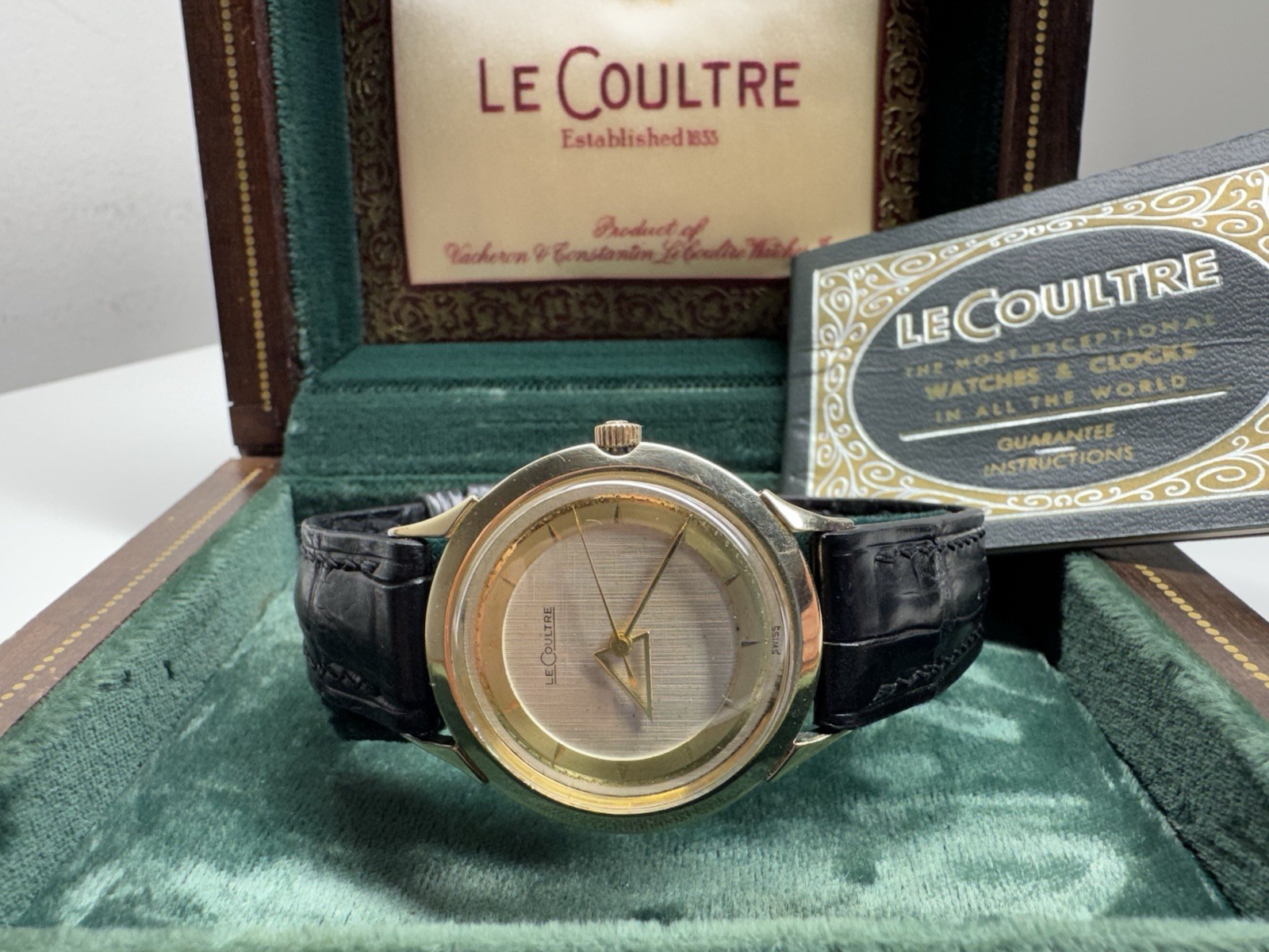 lecoultre rare triangle hour hand mechanical swiss timepiece with box & booklet